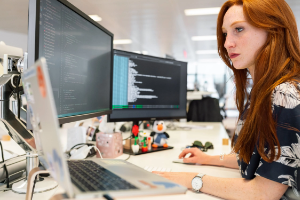 Woman coding on a computer.